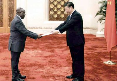 Chrispus Kiyonga presents credentials to China's Xi Jinping