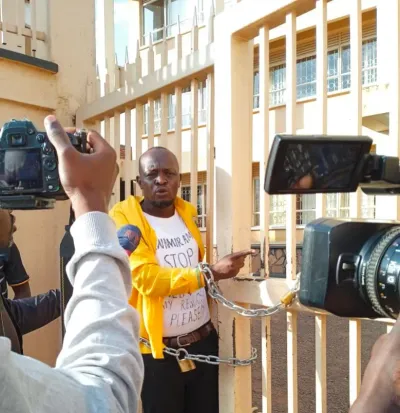 Isingiro North Aspirant Chains Himself at UNEB Gate Following Election Disqualification