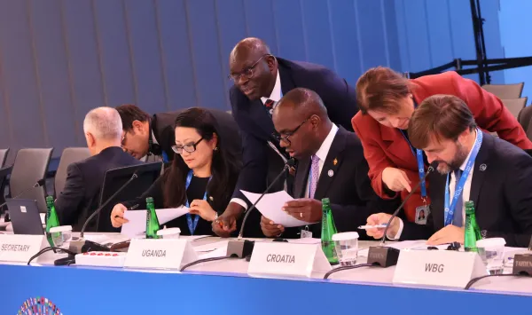 Musasizi Calls for Climate Resilience in Debt Assessments