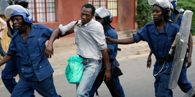 Police in Burundi arrests a man during a demonstration against President Pierre Nkurunziza’s agitation for a their term