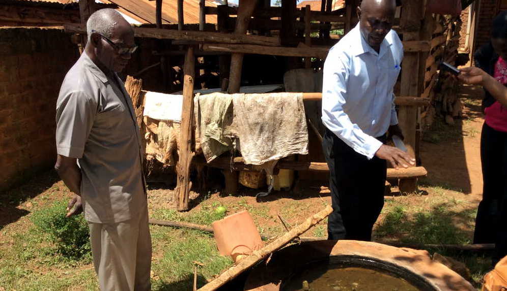 Mzee Sserwadda (left) was commended for keeping the biogas system in good shape for over five years