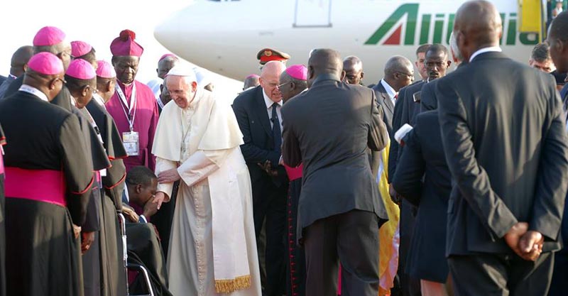 Pope Francis greeting Ugandans at Entebbe International Airport