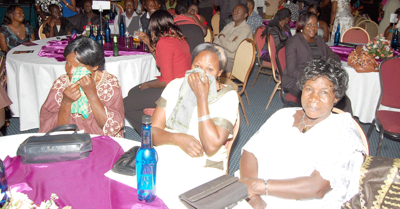 EMOTIONAL: Minister Mutagamba with table mates shed tears at Judith Babiryes concers