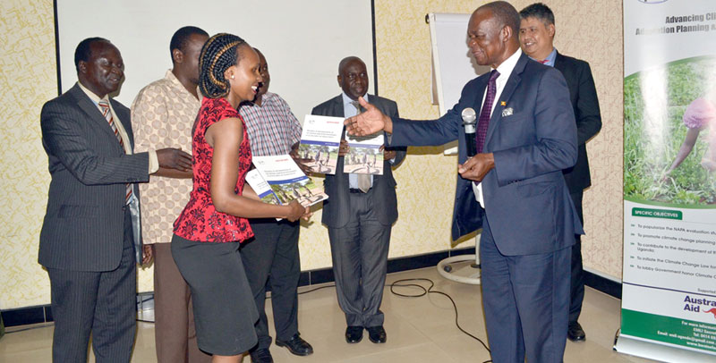 NAPA chair Dr. Kisamba Mugerwa receiving a copy of the NAPA survey last week