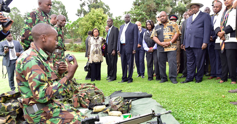 President’s Museveni and Bongo of Gabon (2nd L) of Gabon watch demonstrations by Kenyan wildlife rangers on how to respond to emergencies at the Giant Club Summit at Fairmont Hotel in Laikipia Kenya recently