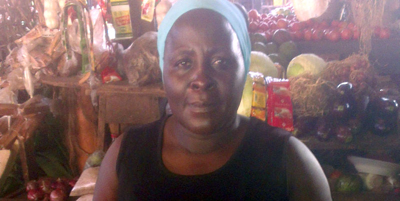 Nagombe in her stall in Kajjansi market
