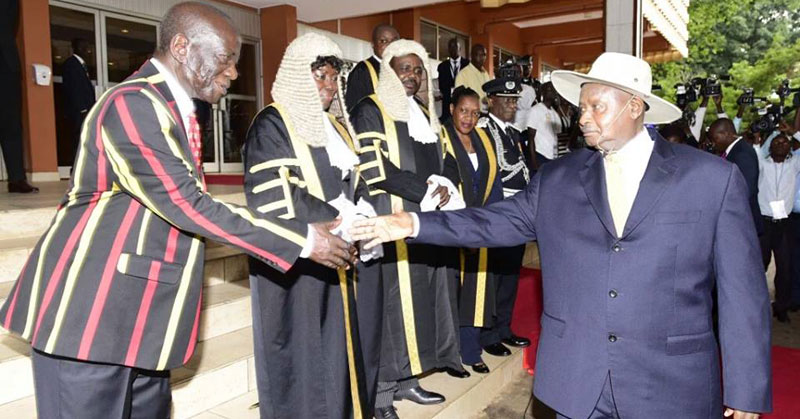 President Museveni greeting vice president Ssekandi and speakers of the 10th parliament