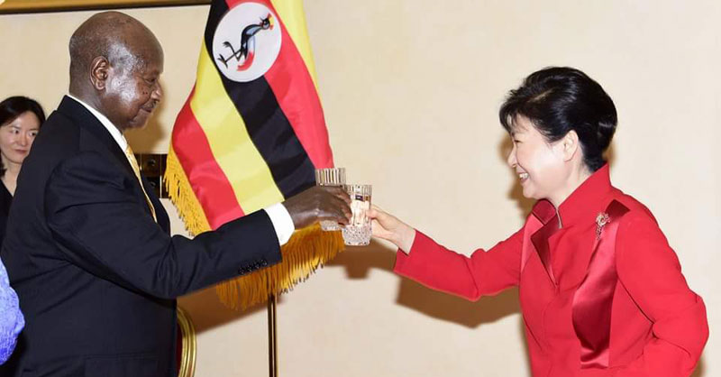 President Park (right) and her host Y.K. Museveni share a toast