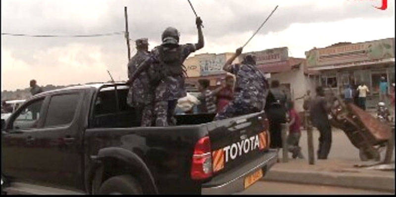 Police officers were captured in a video whipping people celebrating Dr. Besigye’s release