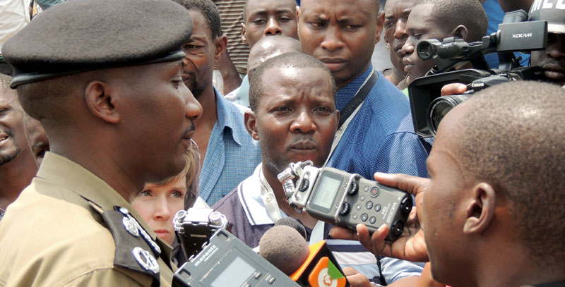 IIN THE EYE OF THE STORM: Police spokesman Andrew Felix Kawesi with journalists