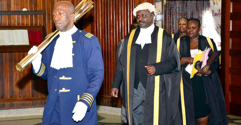 Sergeant at Arms Ahmed Kagoye with the Deputy Speaker of Parliament Jacob Oulanya 