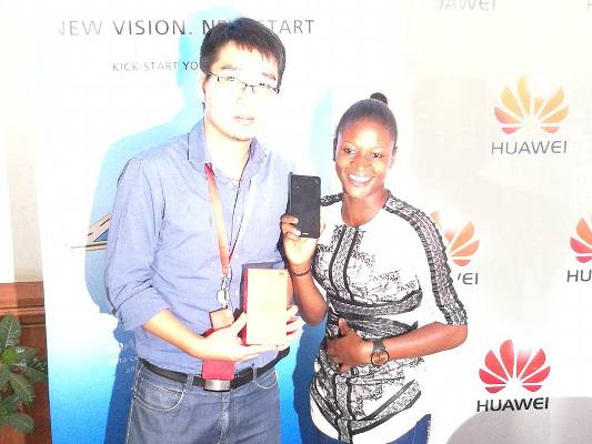 Our lucky winner for today Doreen Nantege from ABS TV walks away with a brand new HuaweiY6II at a press conference in Kampala.