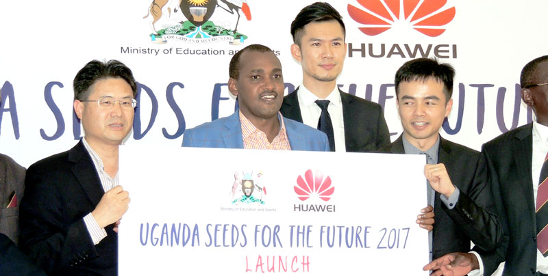 Minister of ICT Frank Tumwebaze center flanked by Chinese deputy Ambassador Chu Maoming (L) and Huwaei boss Stanley Chyn