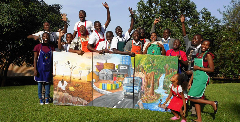 Students celebrate after completing their painting