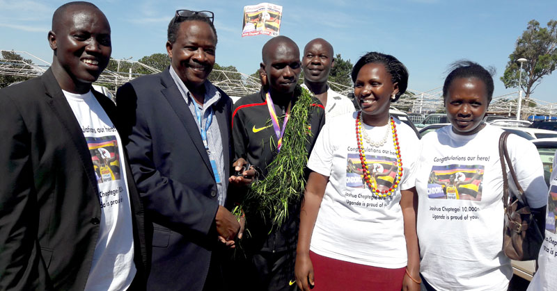CONGRATULATIONS: CAA’s Director Airports and Aviation Security, Eng. John T. Kagoro welcoming back Uganda’s 10,000meter gold medallist Joshua Cheptegei on return at Entebbe International Airport.