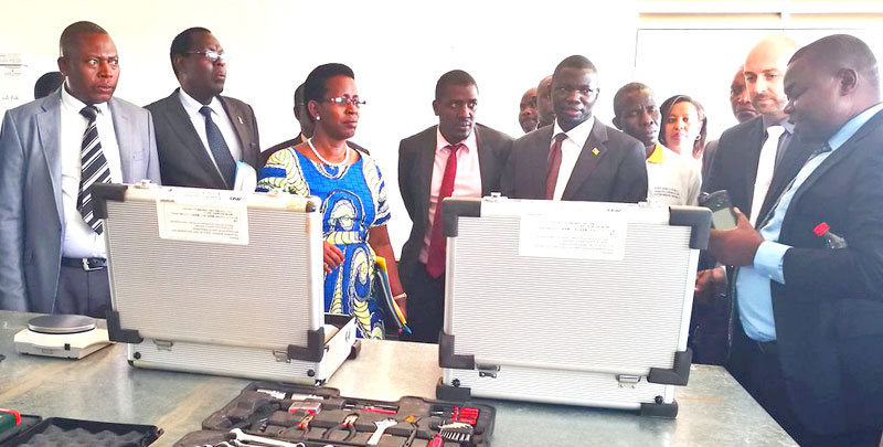 PS Diana Atwine (In blue dress) looking at some of the calibration equipment received recently at the UNHLS
