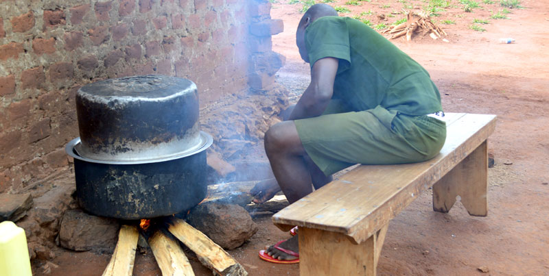 A young lad cooking for his mates at the Juvenile centre