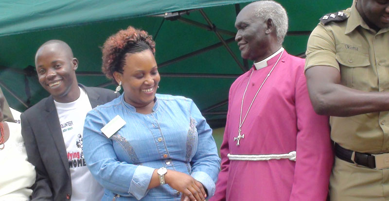 Retired Bishop Rt. Rev. McLeod Baker Ochola II chating with one of the women’s rights campaigners