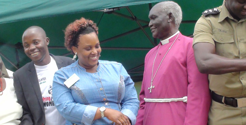 Bishop-Nelson-Onono-Onweng-chats-with-a-lady-in-Gulu-town-recently.
