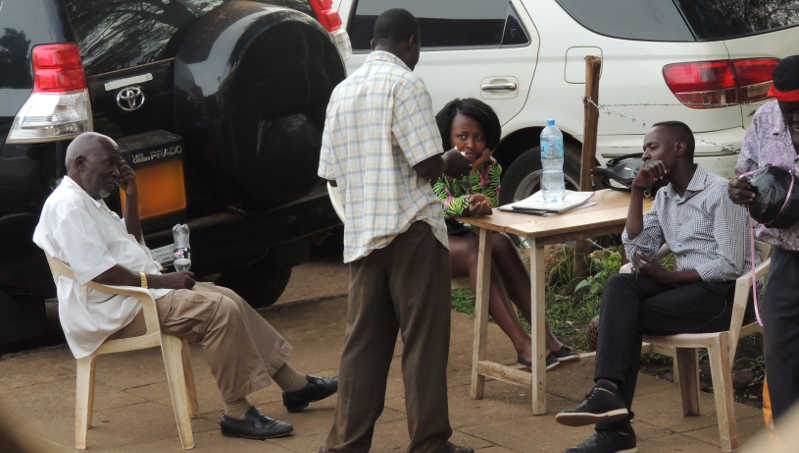 There was an eaqually low voter turn-out at the Radio Uganda polling station at the National Theater as seen in this photo where update officers spent most of the days in banter 