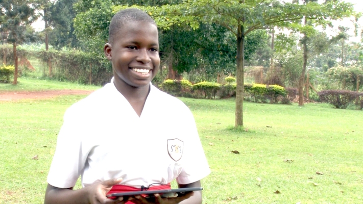 Martha Abenaitwe, a student of Mt. St Mary's Namagunga displays her tablet