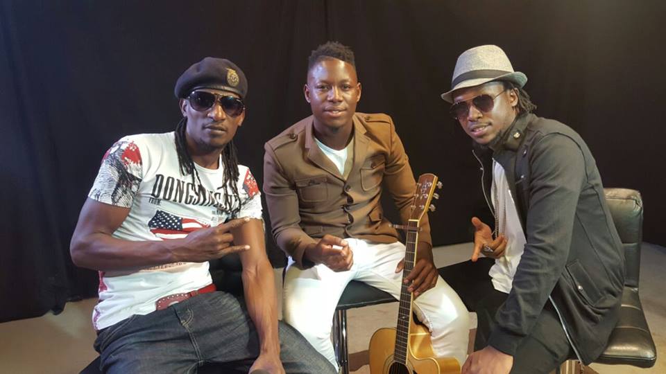 Song writer Black Skin (L) with friends