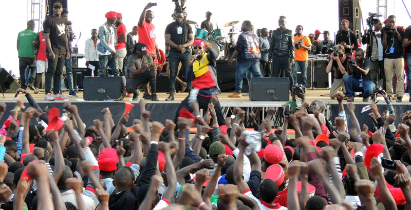 Eddy Kenzo on stage with other musicians