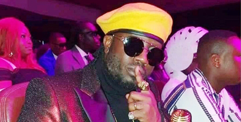 Bebe Cool wearing the yellow beret