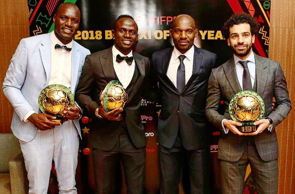 Dennis Onyango (left) with Mane, and Salah pose with their awards