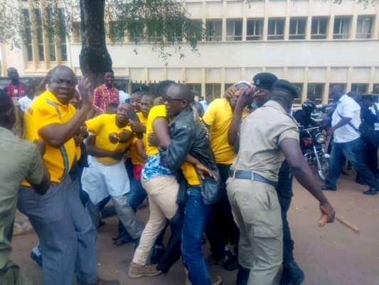 Police arresting youths outside parliament