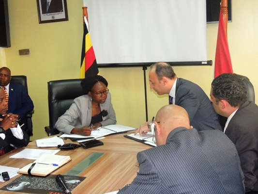 minister Aceng and Amb. Sallam signing the MoU