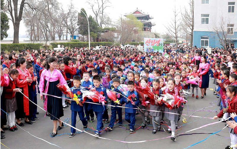 Children entering into school grounds under the benefit of 12-year universal compulsory education system