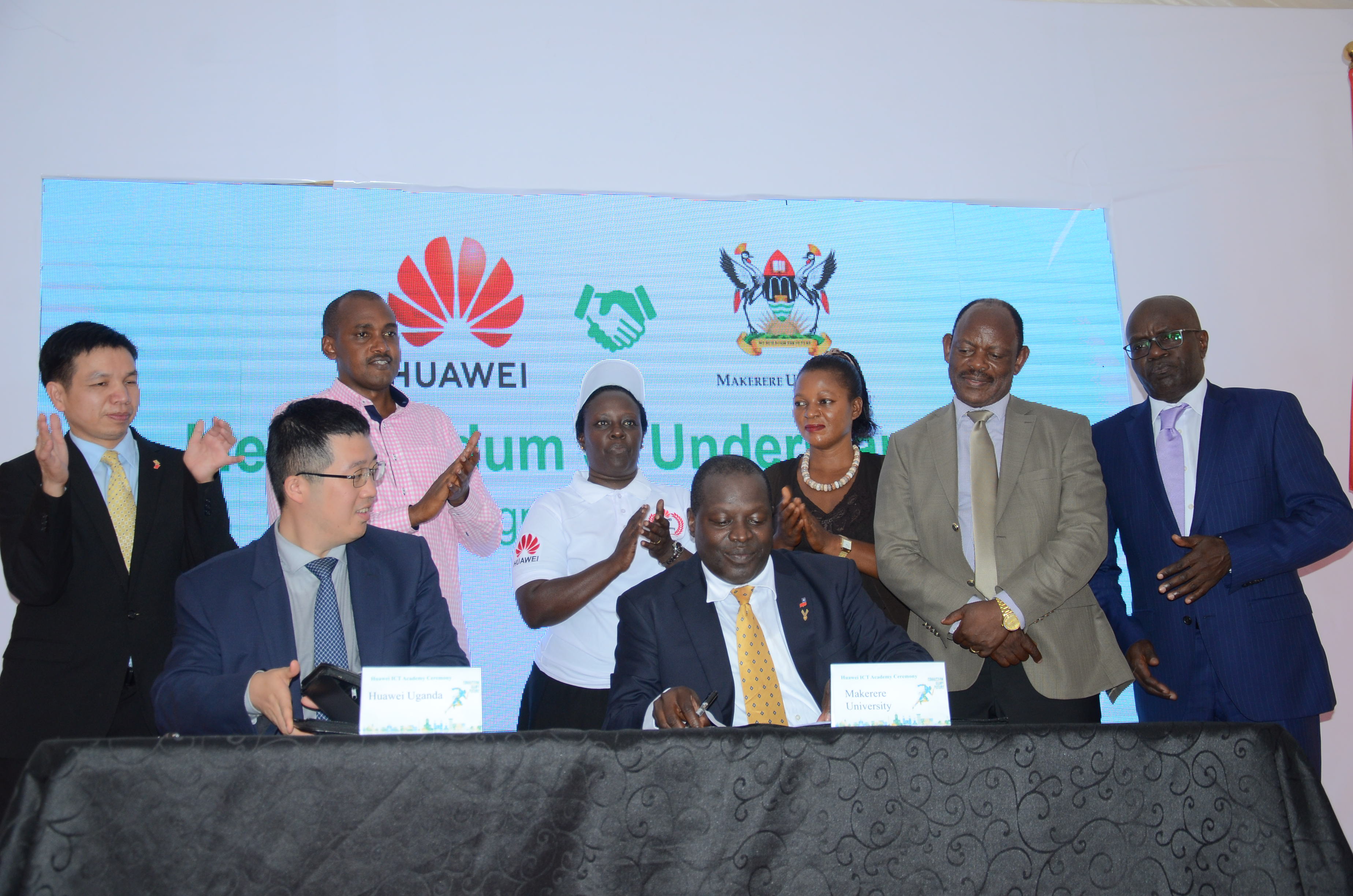 Huawei MD Liujiawei (L) and College of computing principal Prof. Tonny Oyana(R) sign MOU To Establish the Huawei ICT Academy in Makerere University