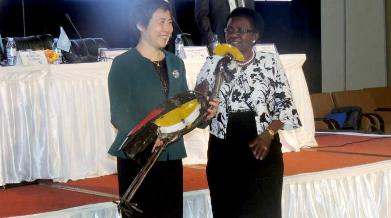 ICAO-SG Dr. Fang Liu receives a prize from Uganda's Minister Monica Azuba Ntege