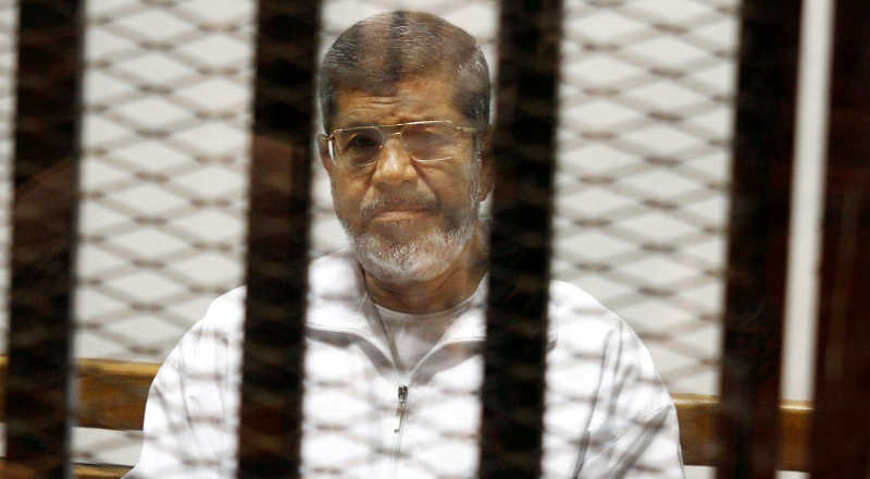 Morsi was kept behind a glass cage even when he was in court