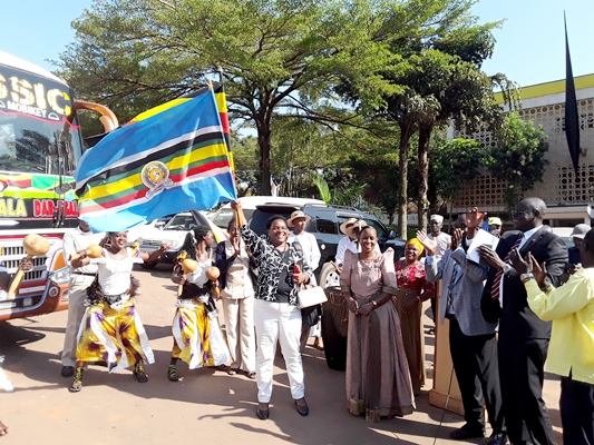Minister Peace Mutuuzo (In white pants) and Nakiwala Kiyingi in Gomes) flagging off the JAMAFEST team at the National Theatre in Kampala