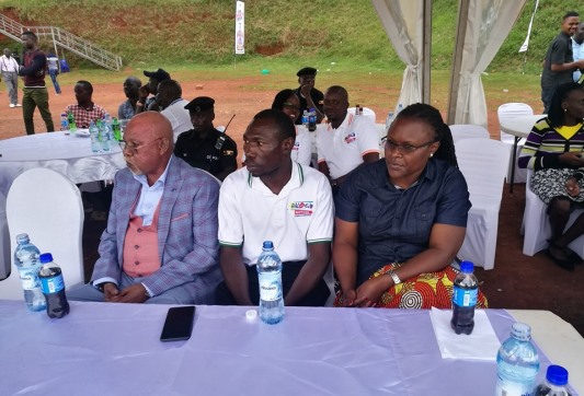 Edulu Micheal the Akogo Media relation officer middle (Middle) and the Internal Affairs Minister (left) andf other officials during the launch in Kampala