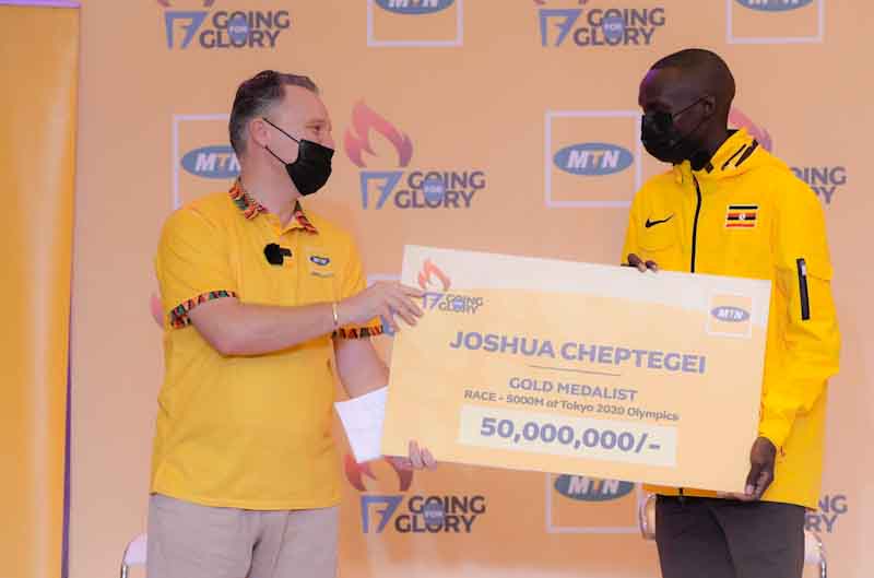 MTN hands over dummy cheque for his gold gold medal