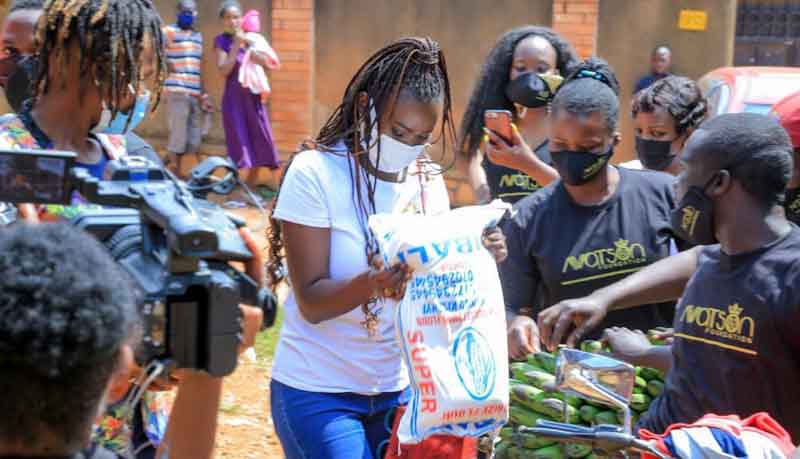 Ms Watson delivering food assistance to disadvantaged communities hit by COVID-19 in Kampala