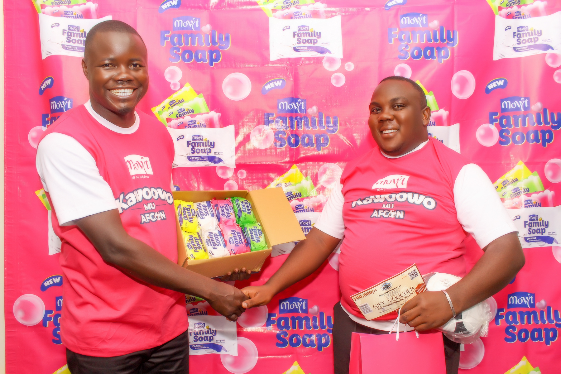 Movit Brand Manager Mr. Stephen Adinyai handing over the gifts to the AFCON Finals winner Ron Hemed.