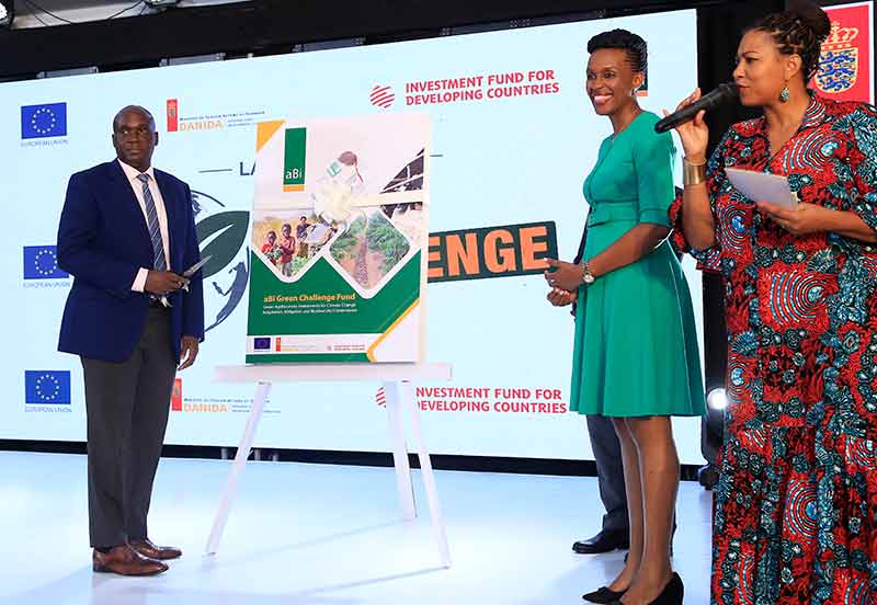 Felix-Okoboi-left,-the-Chairperson-of-the-aBi-Board,-Mona-Muguma-Ssebuliba,-aBi-CEO,–and-Popular-MC-Crystal-Newman-at-the-launch-of-the-UGX-7.5-billion-Green-Challenge-Fund-for-Climate-Change