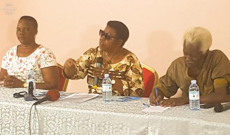 Former Minister Miriam Matembe, Centre, speaking about human rights violations, while Wasswa Like, on the right takes notes