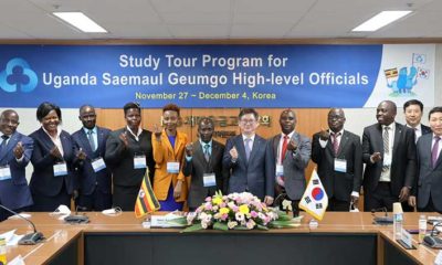 Ugandan delegates in a historic picture with KFCC Vice President (Centre) at the organisation's headquarters in Seoul, South Korea
