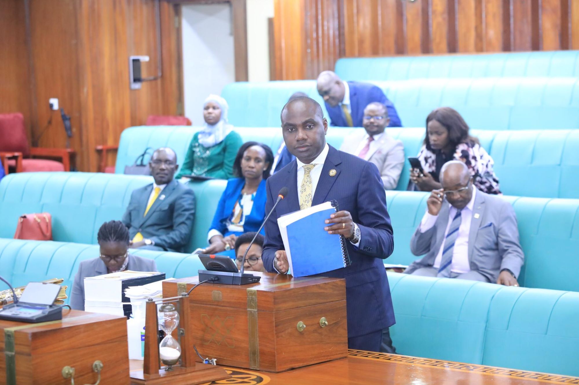 Minister of State for Finance (General Duties), Henry Musasizi speaking during the House sitting on Thursday, 27 March 2025
