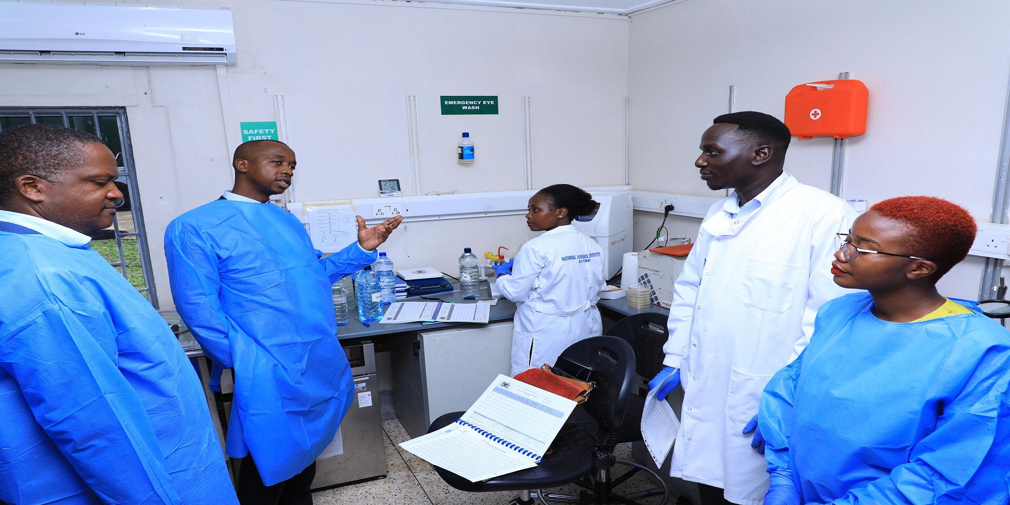 MPs led by Hon. Ayume (2nd L) interacting with medical officers at Entebbe Hospital during the visit