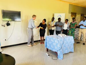 Alliance of Women Advocating for Change (AWC), with Executive Director Maklean Kyomya