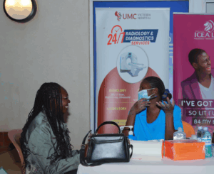 Medical officer conducts a medical test on a visitor at the medical camp at ICEA LION