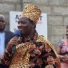 Mathias Mpuuga dressed on ICU cultural attire while talking to DF delegates in Soroti