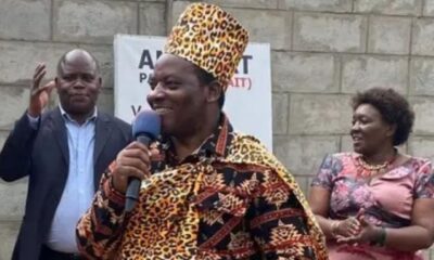 Mathias Mpuuga dressed on ICU cultural attire while talking to DF delegates in Soroti