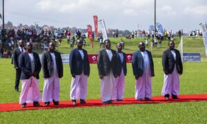 Owek. Charles Peter Mayiga, the Katikiro of Buganda, Ali Balunywa, the Head of Sales at Airtel Uganda and other officials of Buganda Kingdom pose for a photo before the Finals at Wankulukuku Stadium